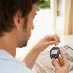 A man is monitoring his insulin levels.