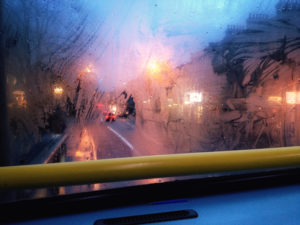 A foggy bus window.