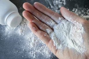 Talc powder on a hand.