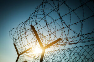 Barbed Wire Fence illustrating the impact of Wrongful Convictions